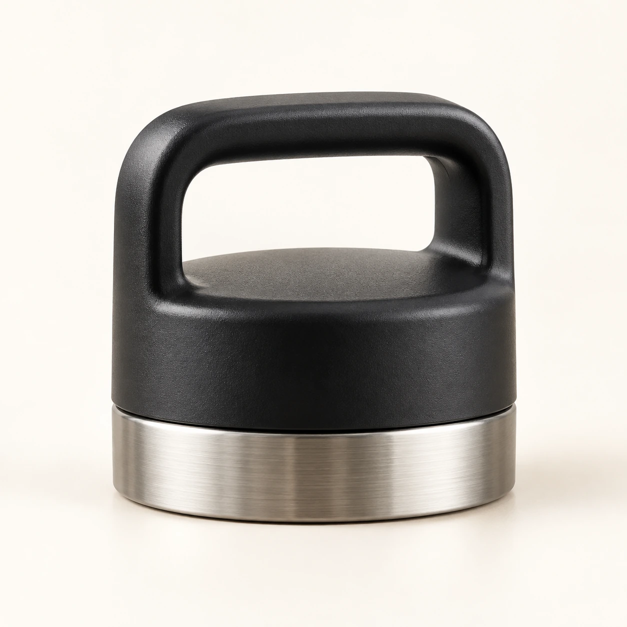 Matte black bottle cap with carrying handle and stainless steel ring
