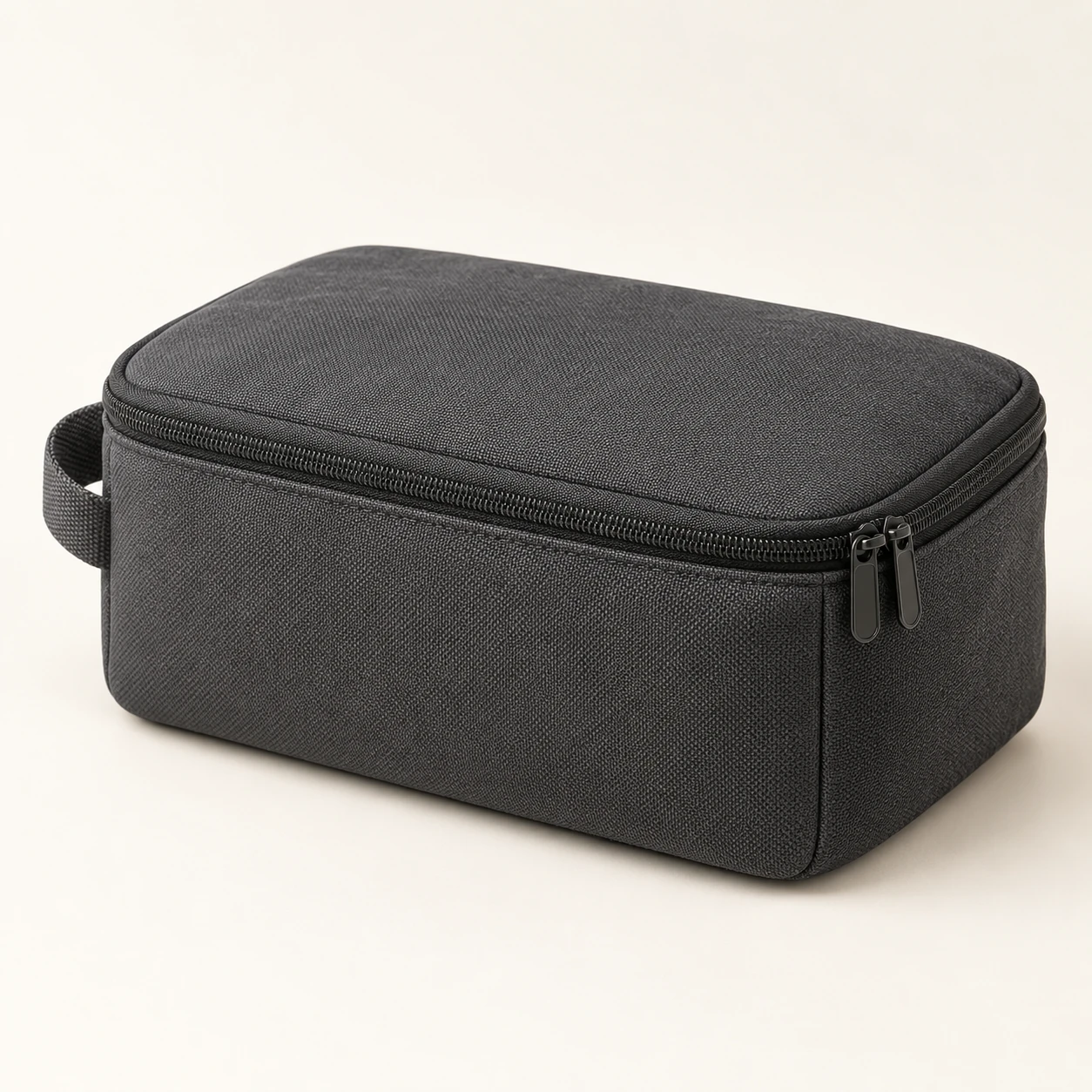 Graphite-colored NORDLYN Transit Pouch with zipper in three-quarter view