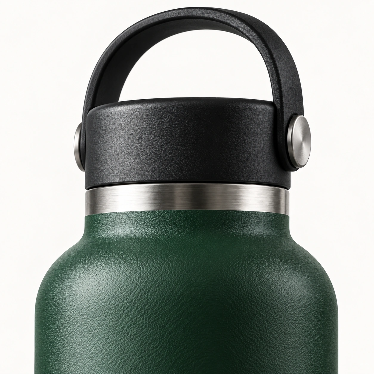 Close-up of the carrying handle, stainless steel ring, and dark green surface of the Fjell 500