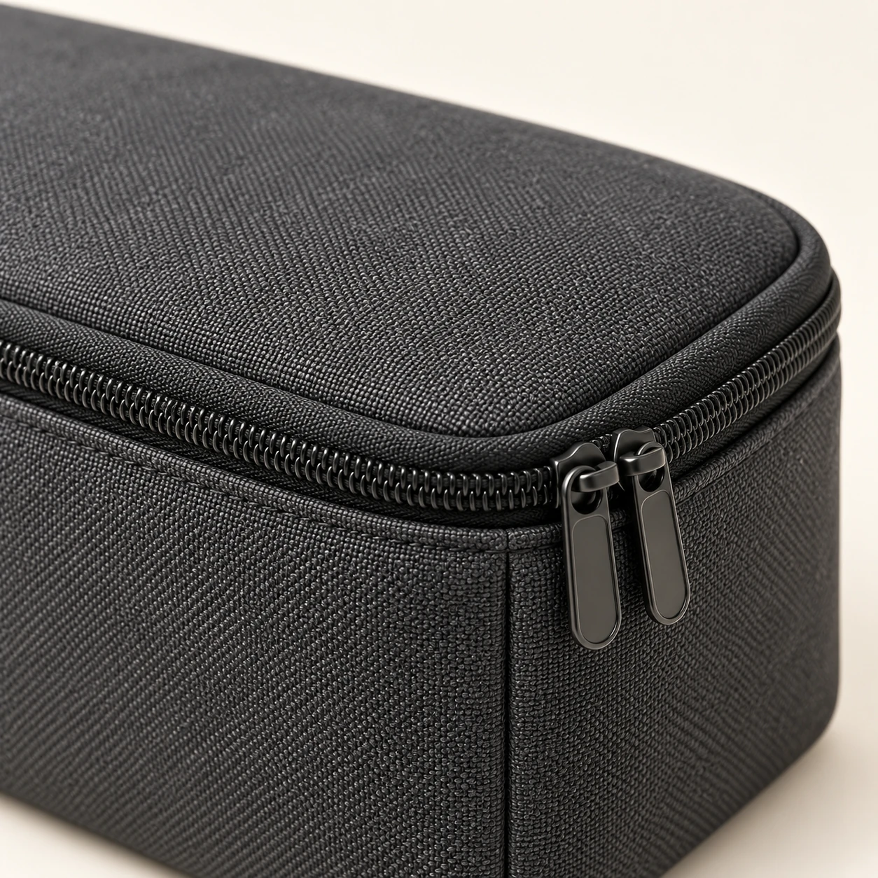 Close-up of the fabric structure and the double zipper of the NORDLYN Transit Pouch
